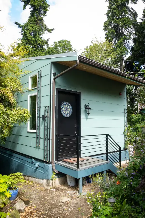 Their new door is adorned with a handmade leaded glass window, new paint, custom fabricated railings, and pretty flower trellises around the corner. Their new door is adorned with a handmade leaded glass window, new paint, custom fabricated railings, and pretty flower trellises around the corner.