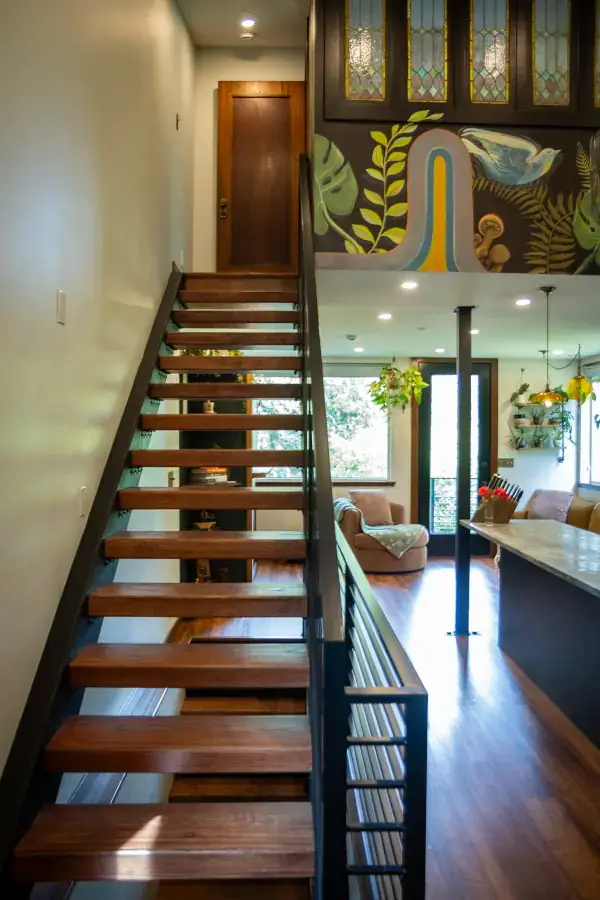 Handsome, custom-fabricated metal staircases with reclaimed wood treads. We opened up the main floor by replacing walls with a steel pillar. Handsome, custom-fabricated metal staircases with reclaimed wood treads. We opened up the main floor by replacing walls with a steel pillar.