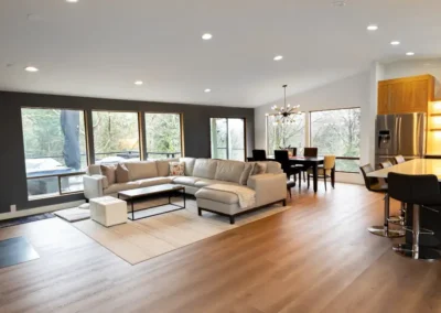 Remodeled open floor plan kitchen, dining, and living spaces.