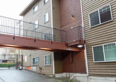 Elevated walkway connects two apartment buildings.