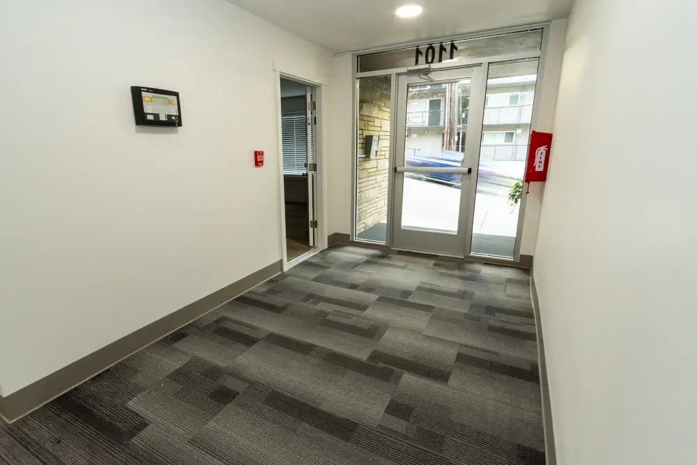 Main entry interior with new flooring, lighting, and paint.