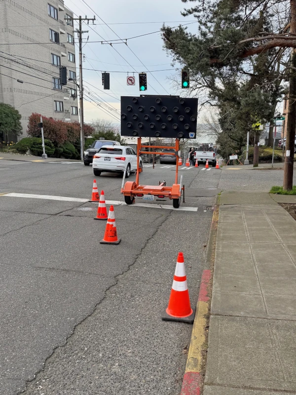 Lanes and sidewalk closed for trenching.
