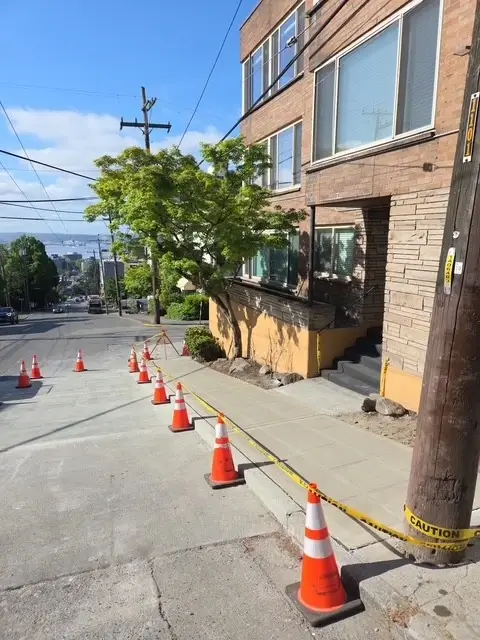 Sidewalk and street repaved after sewer installation. 