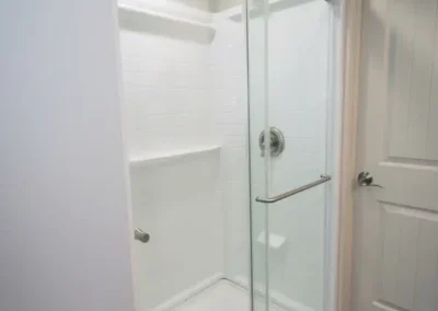 A new shower in place of a storage closet.
