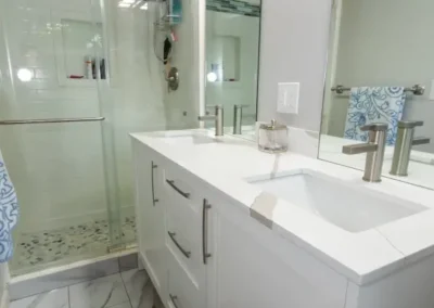 The renovated master bath has double-sinks, a new shower, and a washer and dryer.